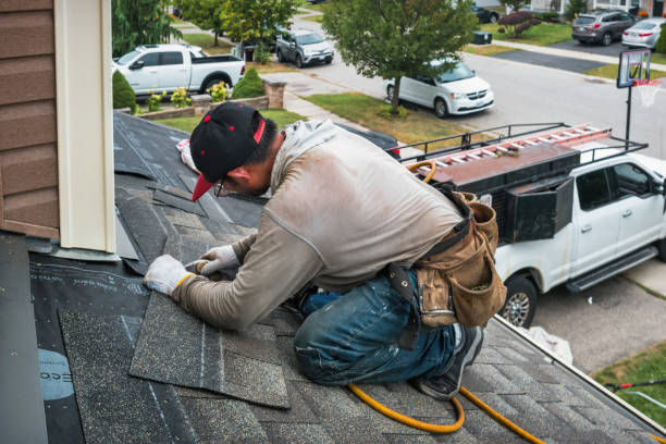 Professional Roofing technician working in West Sand Lake, NY